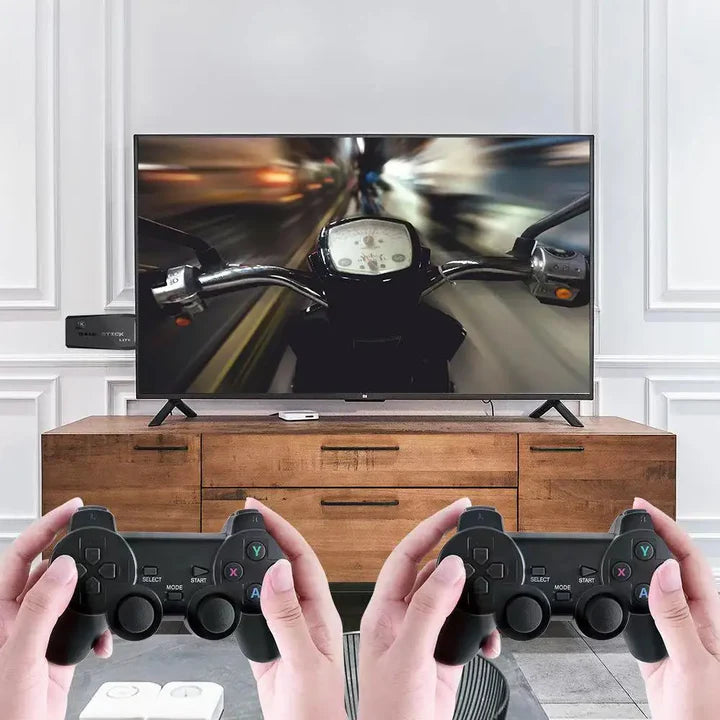 Person playing a racing game on a television with two gaming Dual Wireless Controller Gaming Stick controllers.